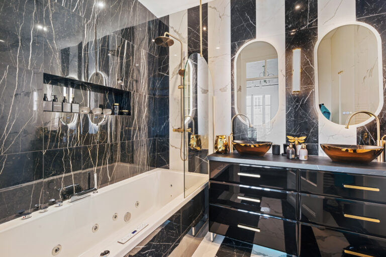 Luxury marble bathroom with walk-in shower after apartment renovation in the French Riviera